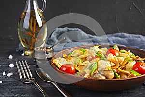 Stir fry farfalle pasta with vegetables, cauliflower and mushrooms