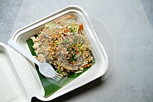 Stir fry glass noodle with minced pork and egg in Unbleached plant fiber food box