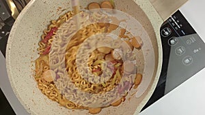 Stir-Fry Instant Noodles with Sausage and Melted Cheese