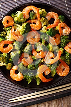 Stir fry with shrimp, broccoli and garlic - Chinese food. clos