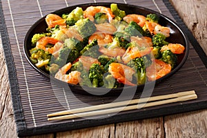 Stir fry with shrimp, broccoli and garlic - Chinese food. clos