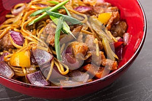 Stir fry with soba noodles, beef meat and vegetables. Udon.