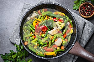 Stir fry vegetables in the wok.