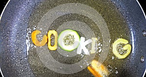 Stir-frying mixed alphabet letters, word cooking