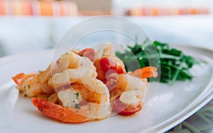 Stirfried shrimps with butter garlic and rocket salad