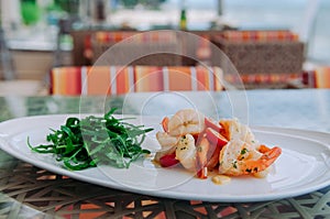 Stirfried shrimps with butter garlic and rocket salad