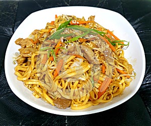 Stirfry noodle with carrot tofu and meat ball