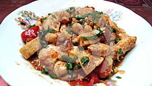 Stirfry tofu, egg and tomatoes with some shrimp, sprinkled with some chopped spring onion, Chinese dish, homemade food