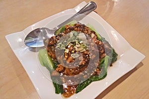 Stirred pok-choy with minced tofu and soyabean soys sauce