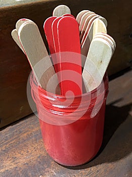 Stirrers in glass jar