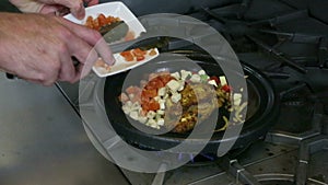 Stirring Chick Dish in a pan