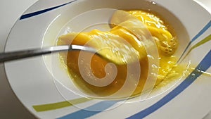 Stirring eggs in plate