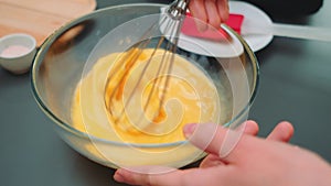 Stirring eggs with a whisk