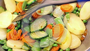 Stirring vegetable mix with spatula