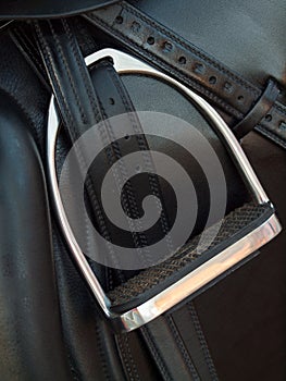 Stirrup at dressage saddle. close up