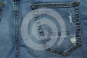 close up texture of stitch on blue jeans textile