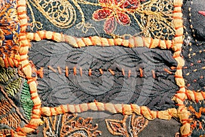 Stitches thread on the ndian patchwork carpet from Rajasthan.