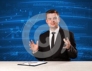 Stock data analyst in studio giving adivce on blue chart background