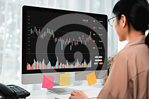 Stock exchange market concept, business people trader looking computer with graphs analysis candle line on table in office.