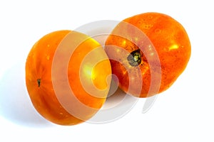 Stock Foto Closeup of yellow orange tomato isolated on white background