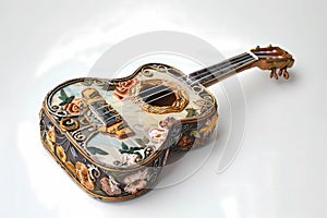 stock image of a guitar on a simple isolated background, and an image