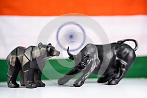 Stock market bull and bear with Indian flag as background - Concept of investment in Indian equity sensex share market