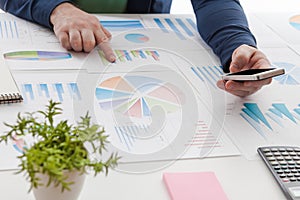 stock market chart and finger pointing on tablet in office