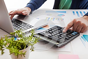 Stock market chart and finger pointing on tablet in office