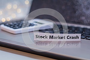 Stock Market Crash business finance doom gloom concept with laptop and stock chart