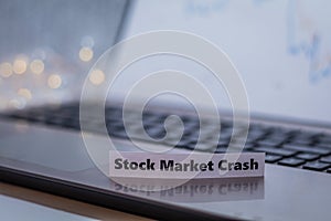 Stock Market Crash business finance doom gloom concept with laptop and stock chart