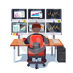 Stock market exchange trader working at desk