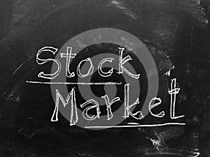 Stock Market handwritten on Blackboard as Stock Image