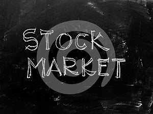 Stock Market handwritten on Blackboard - Stock Image