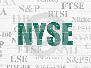 Stock market indexes concept: NYSE on wall background