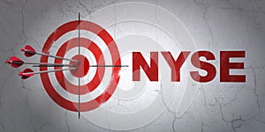 Stock market indexes concept: target and NYSE on wall background