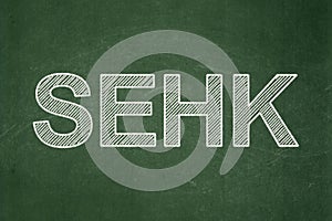 Stock market indexes concept: SEHK on chalkboard background photo