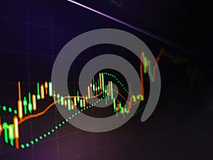 Stock market prices show on display. Study the stock market data on the screen. Business graph with arrow showing profits and