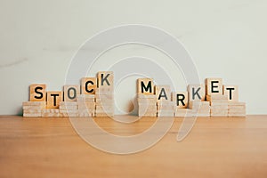 Stock market text from wooden blocks. Financial investment, business and economy concepts