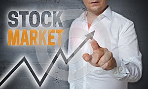 Stock market touchscreen is operated by man