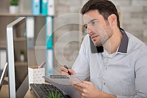 stock market trader doing deal over phone