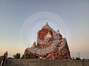 Stock photo of beautiful vaishno devi temple, It looks like a temple on a high hill. temple structure painted by maroon color.