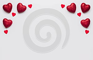 Stock photo of red hearts on a white background with a space for text