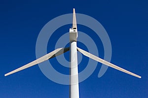 Stock photo of a big windmill with blue sky in the background