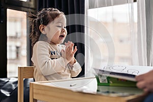 Little Girl Drawing at Home