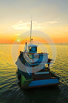Stock Photo:Fishing boat sunrise