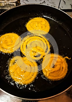 Stock photo of Jalebi or Jilbi or imarati, indian sweet food fried in pure ghee