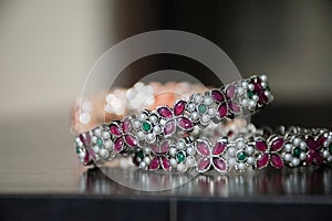 Stock photo of traditional Indian designer bangles or bracelet for women. white and red diamond decorated on the bangle