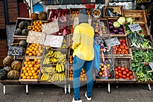 Woman Buying in Street Market