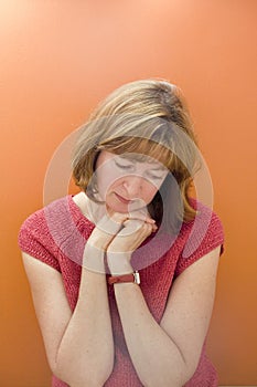 Stock Photo of a Woman on Orange Background