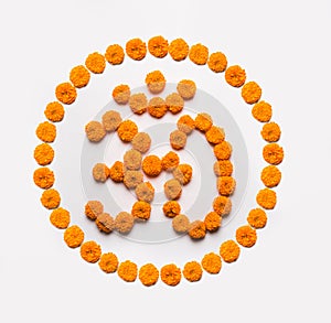 Stock photo of word Aum or om made using marigold flower